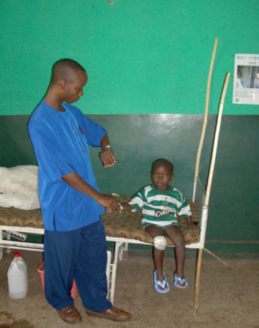 Nurse checking child's pulse - Community Development